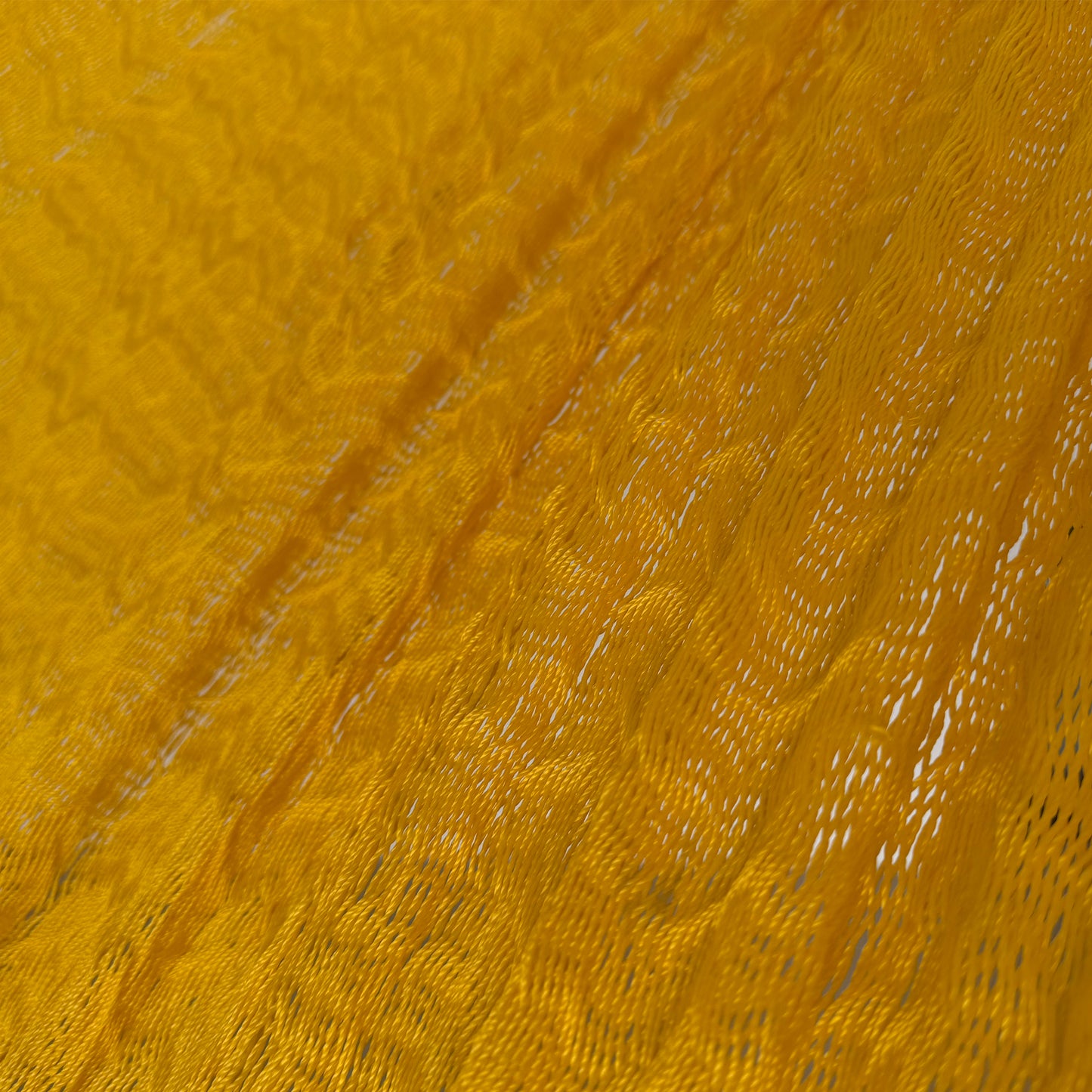 Detalle del tejido de nylon de la hamaca artesanal Yucateca amarilla
