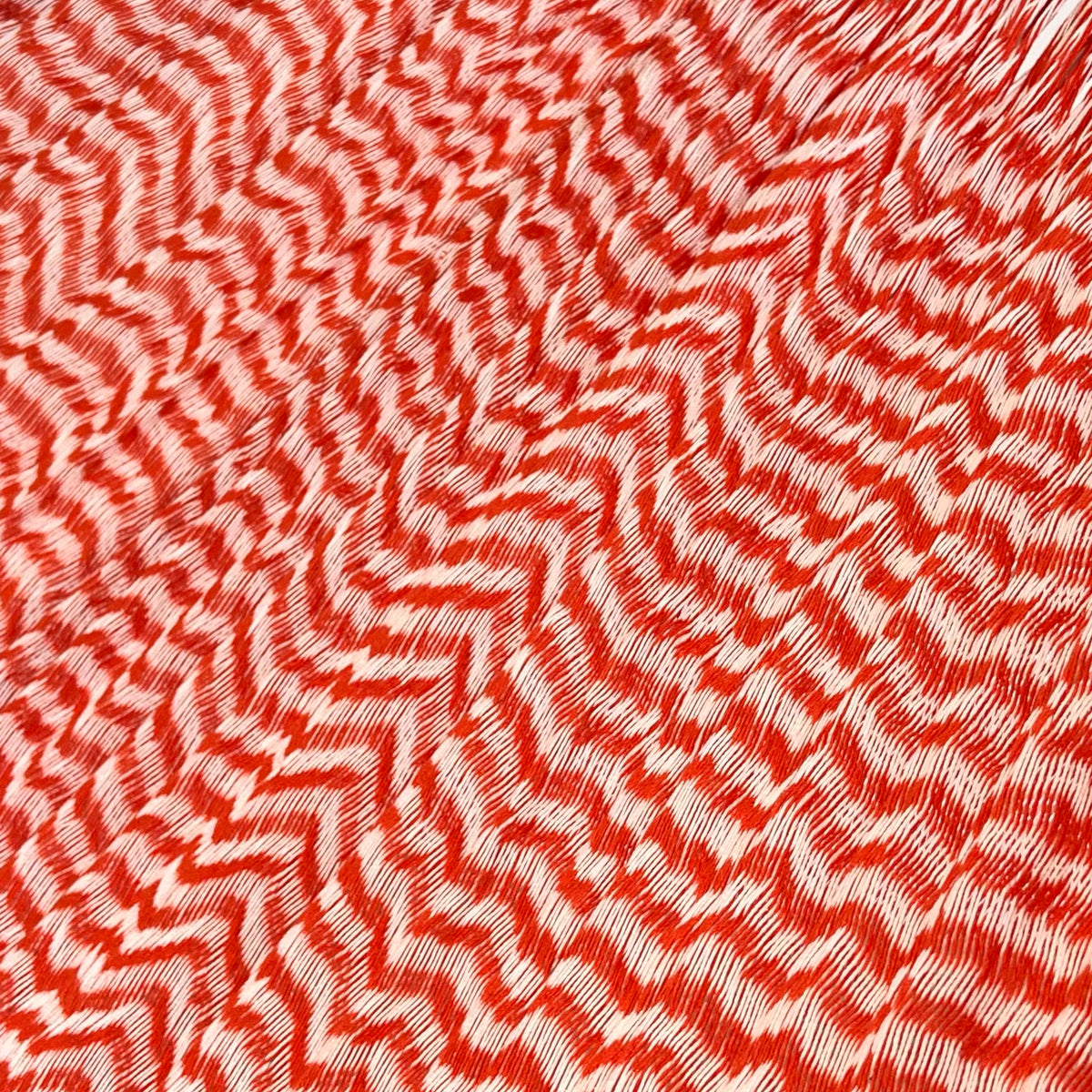 Primer plano del tejido de algodón de una hamaca yucateca artesanal king size color naranja y blanco