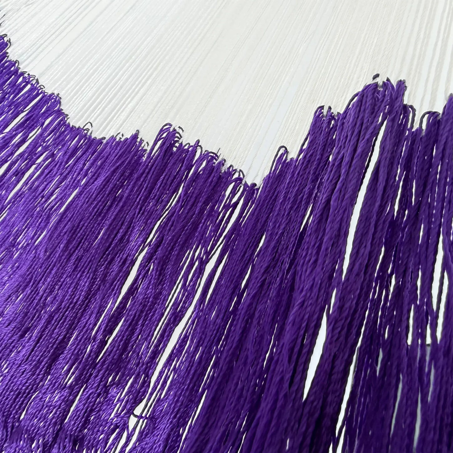 Unión entre el cuerpo y el brazo de hamaca Yucateca artesanal de nylon morado