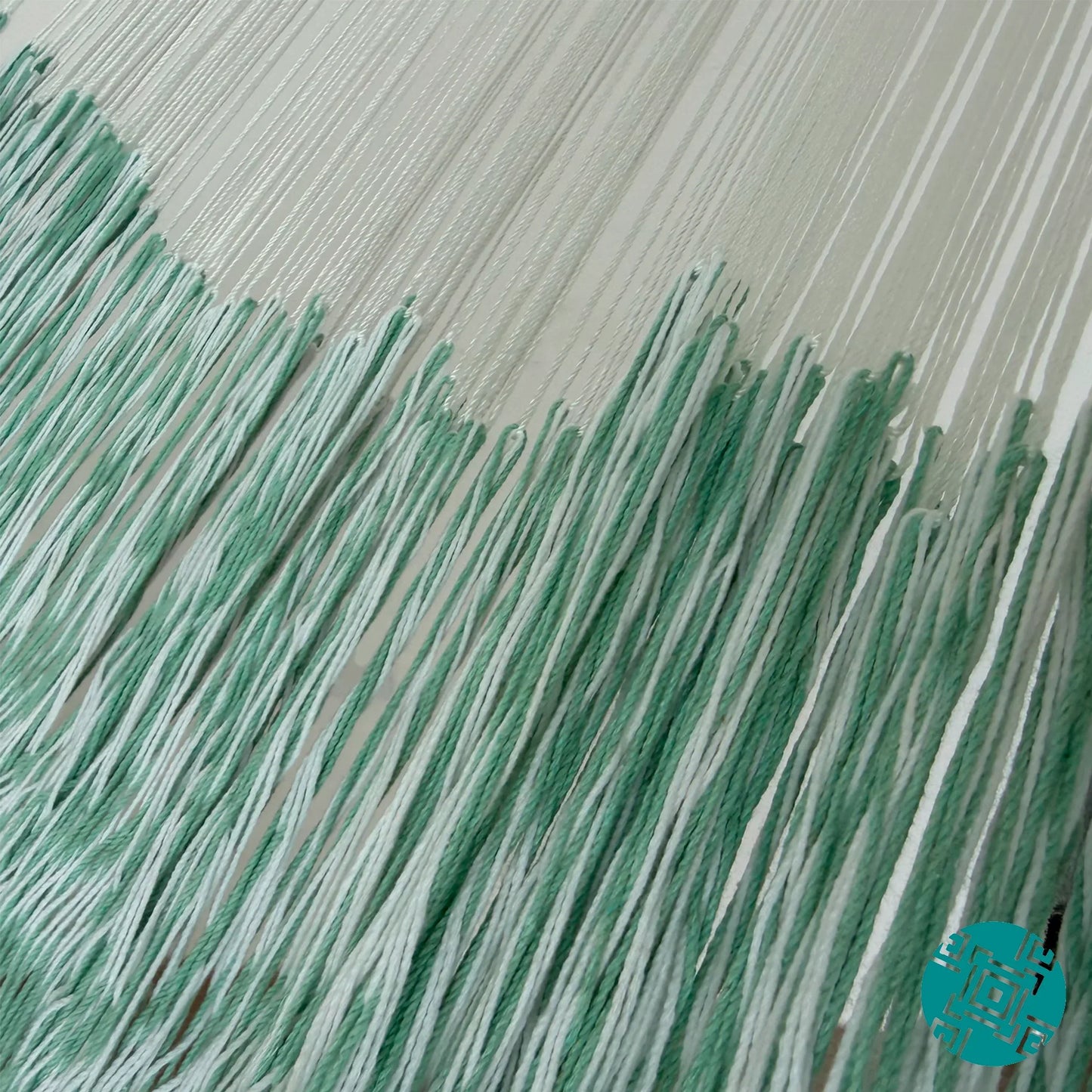 Unión entre cuerpo y brazo de hamaca Yucateca artesanal de algodón suave color menta