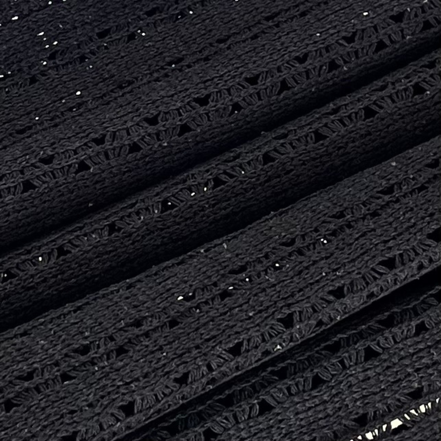 Detalle del tejido de hamaca negra de algodón colgada