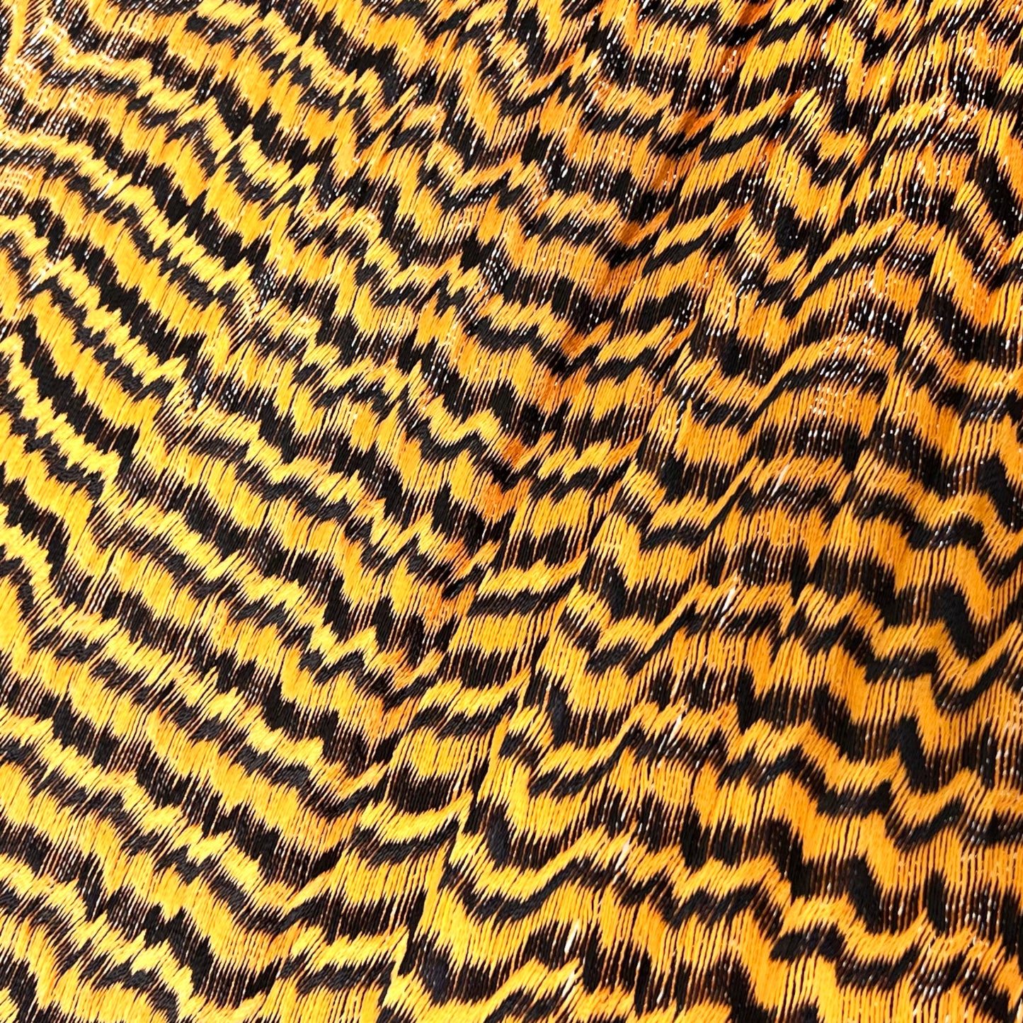 Detalle del tejido de nylon de la hamaca artesanal Yucateca naranja y negro
