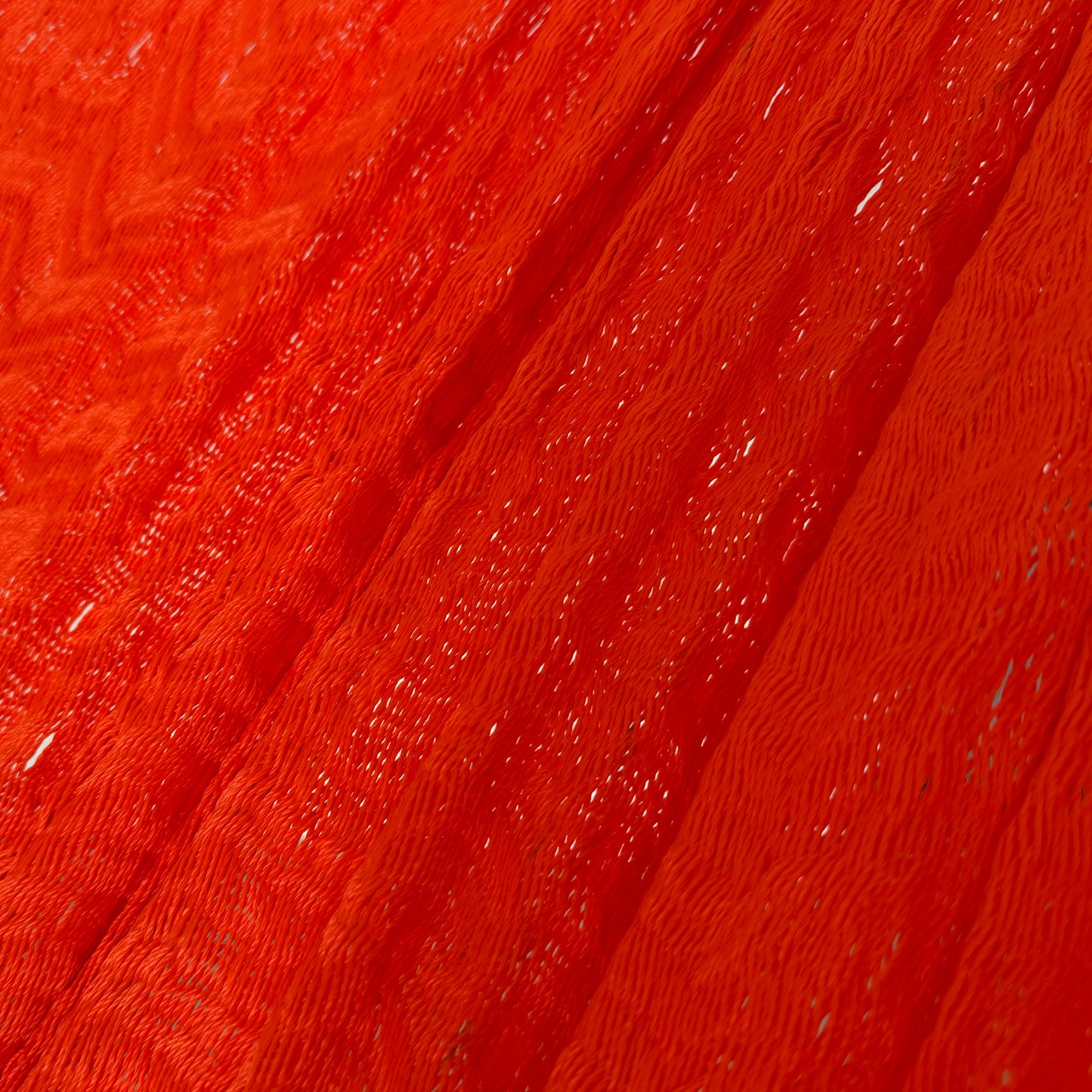 Detalle del tejido de nylon de la hamaca artesanal Yucateca rojo