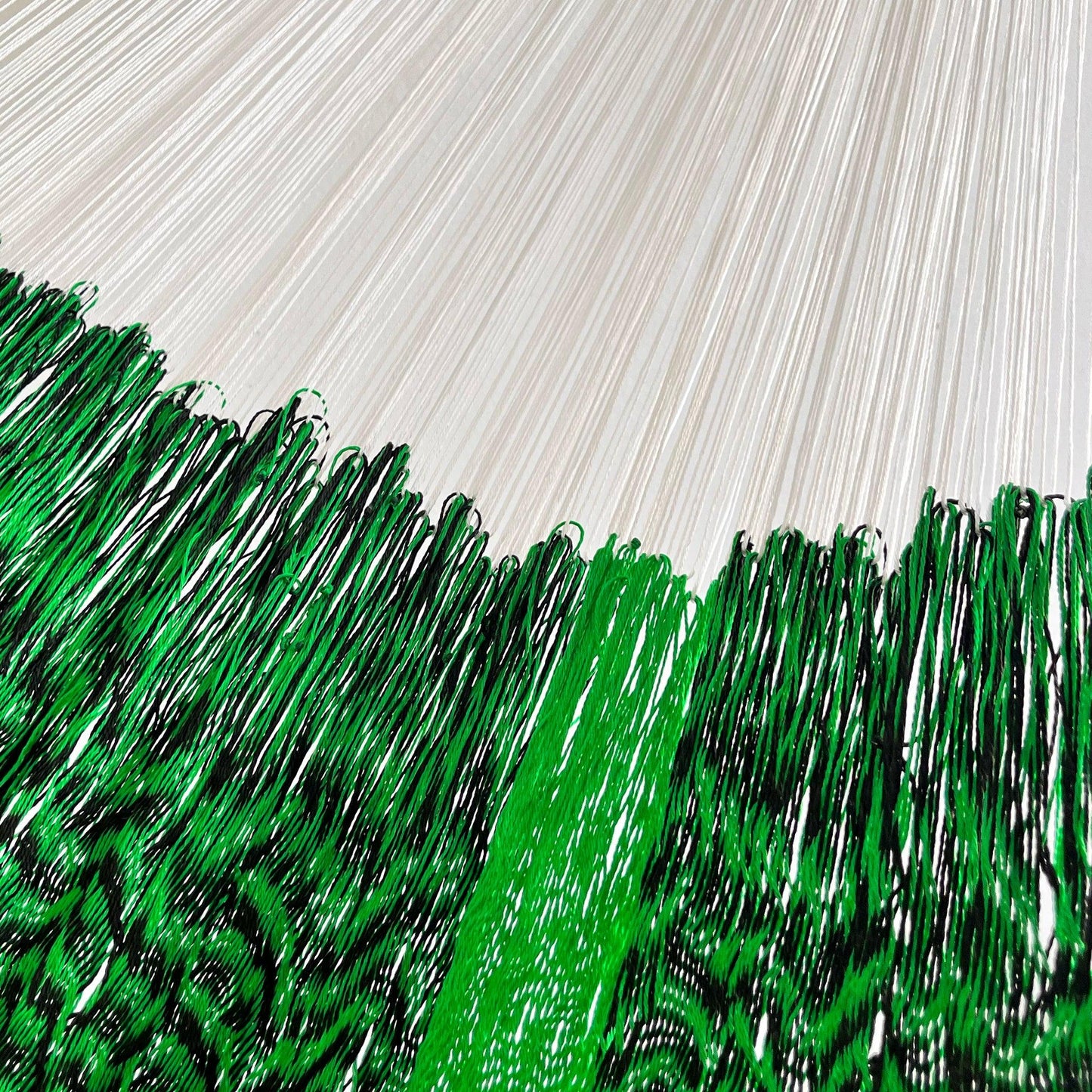 Unión entre cuerpo y brazo de hamaca artesanal Yucateca de nylon color verde y negro