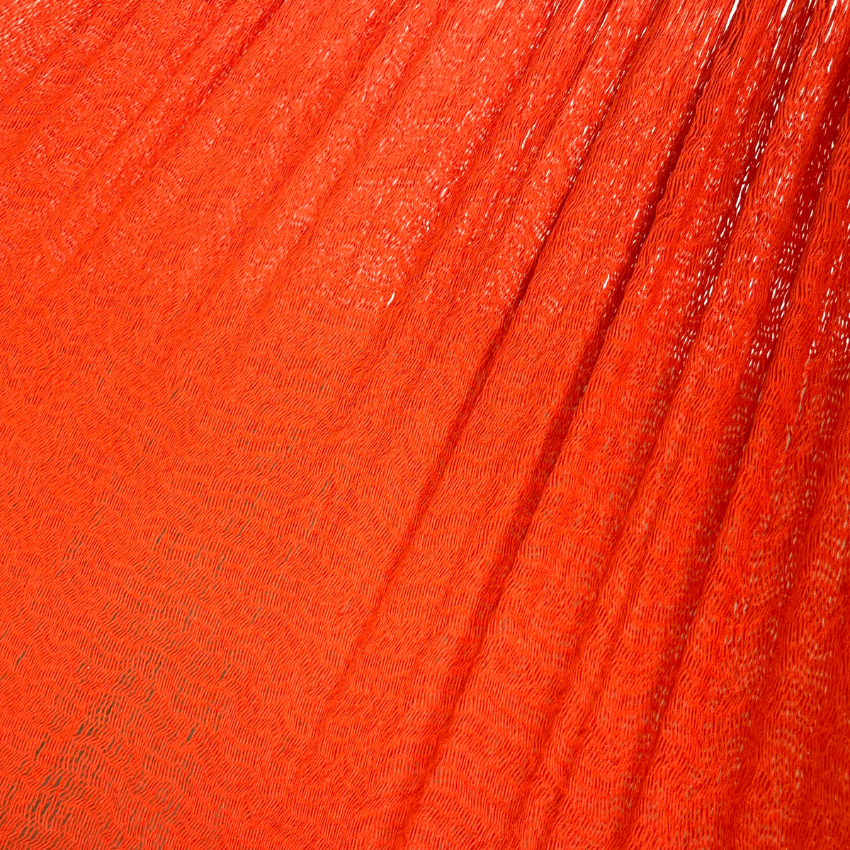 Primer plano del tejido de algodón de una hamaca yucateca artesanal king size color naranja