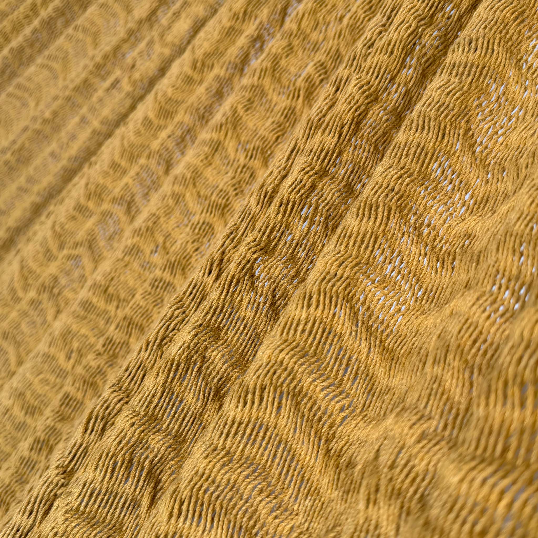 Detalle del tejido de algodón suave de hamaca Yucateca artesanal dorado