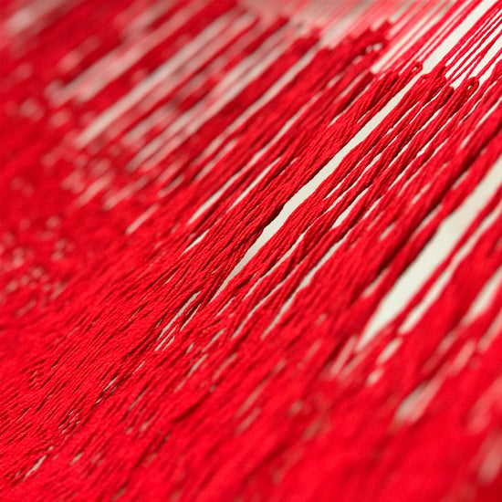 Unión entre cuerpo y brazo de hamaca Yucateca artesanal de algodón suave modelo Rojo