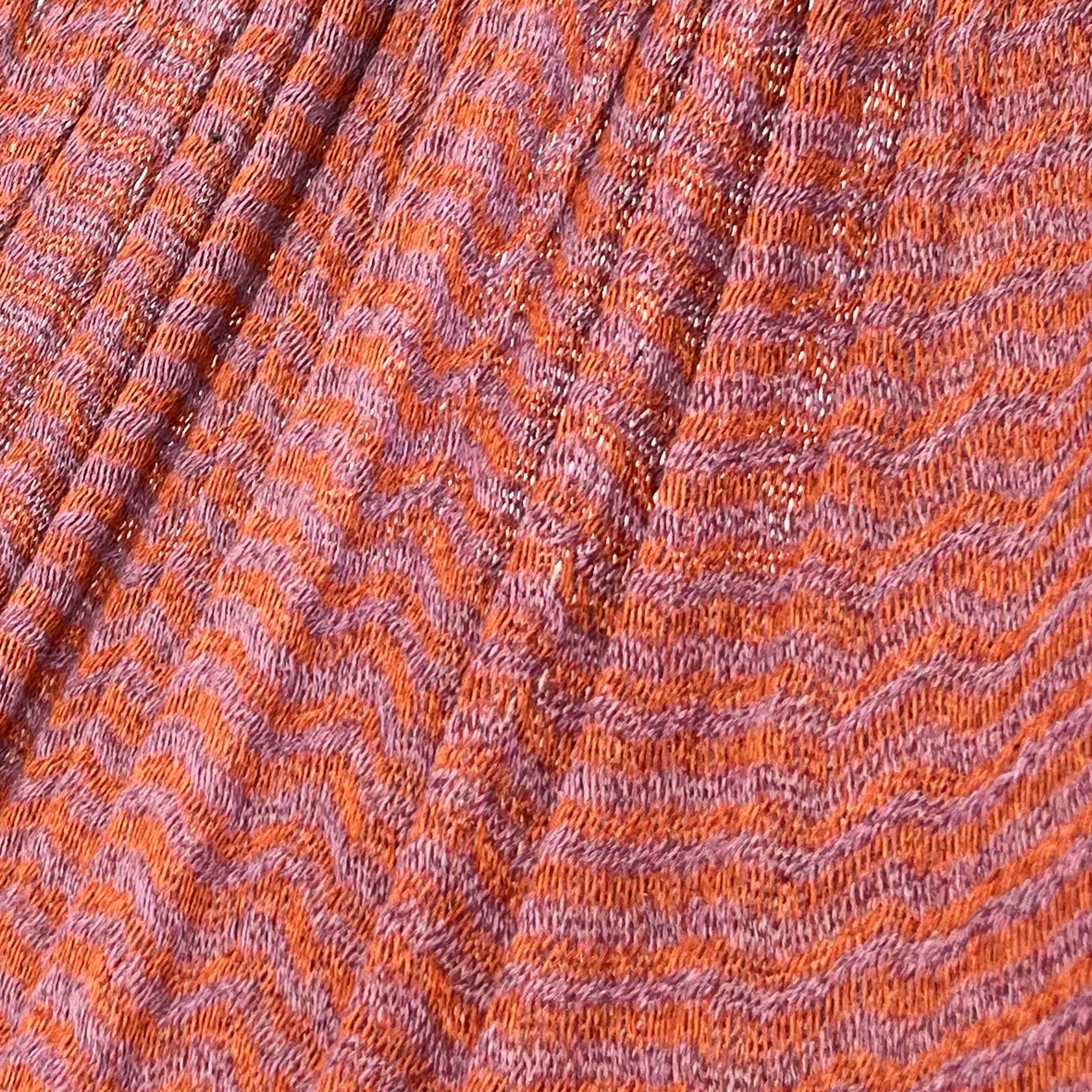 Detalle del tejido de algodón suave de la hamaca Yucateca artesanal rosa y naranja