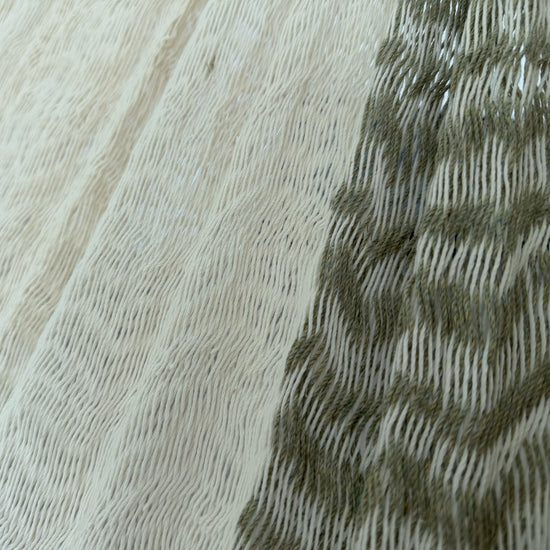 Detalle del tejido de algodón suave de la hamaca Yucateca artesanal verde y blanco
