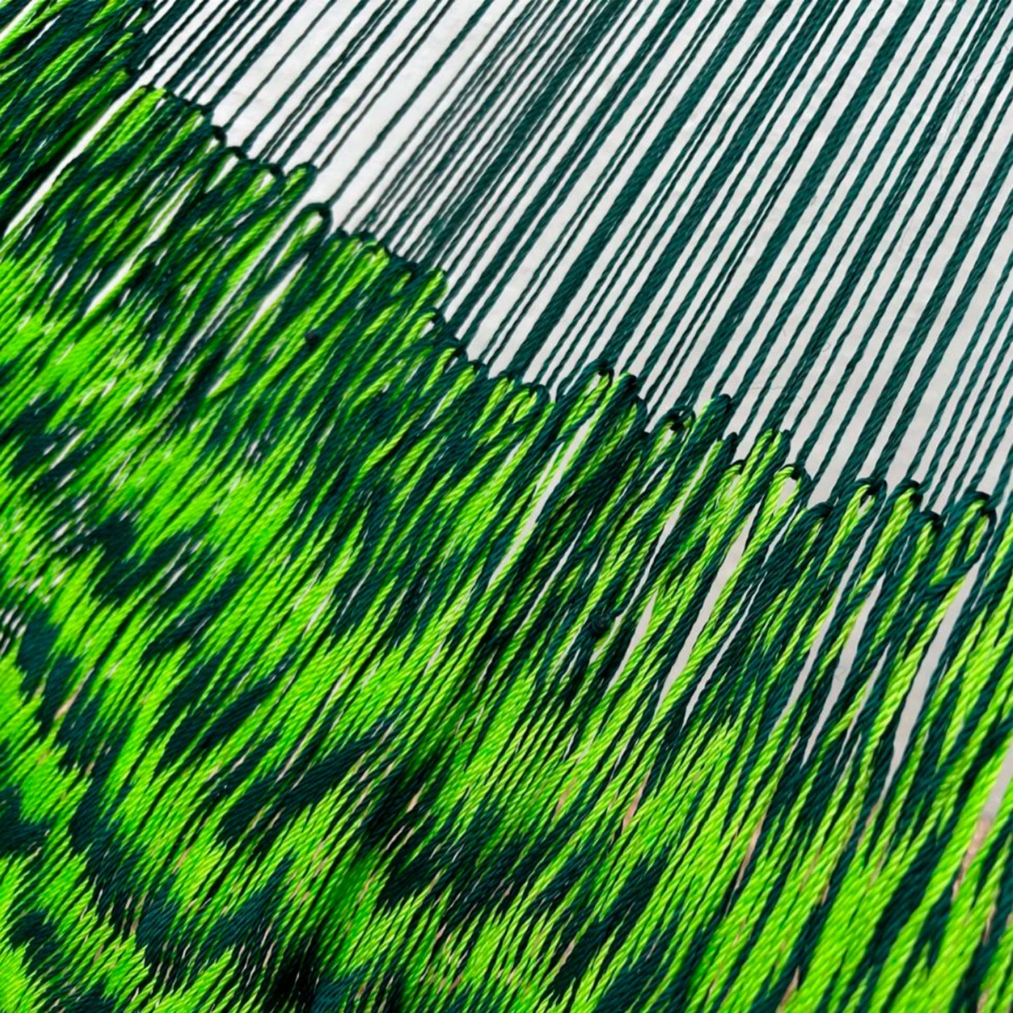 Unión entre el cuerpo y el brazo de hamaca Yucateca artesanal de hilo 18 de nylon verdes