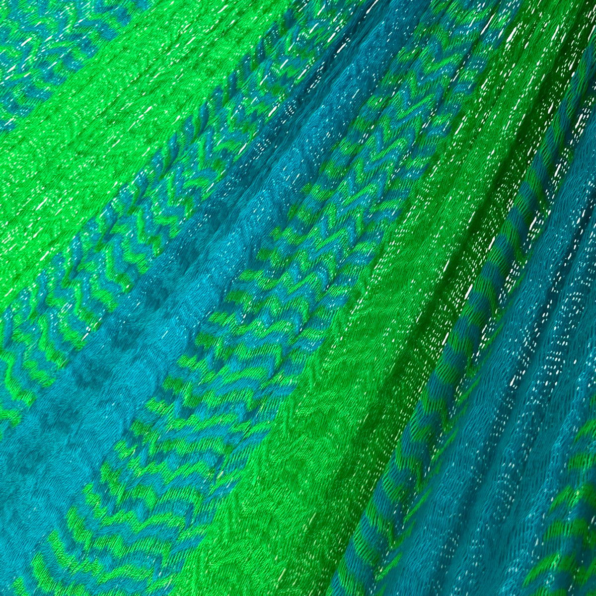 Primer plano del tejido de nylon suave de una hamaca yucateca artesanal color verde y azul