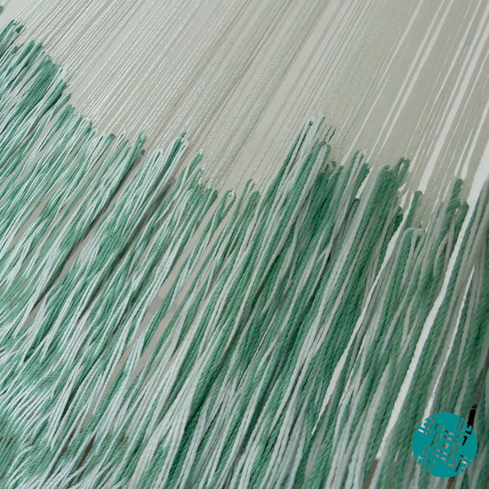 Unión entre cuerpo y brazo de hamaca Yucateca artesanal de algodón suave color menta