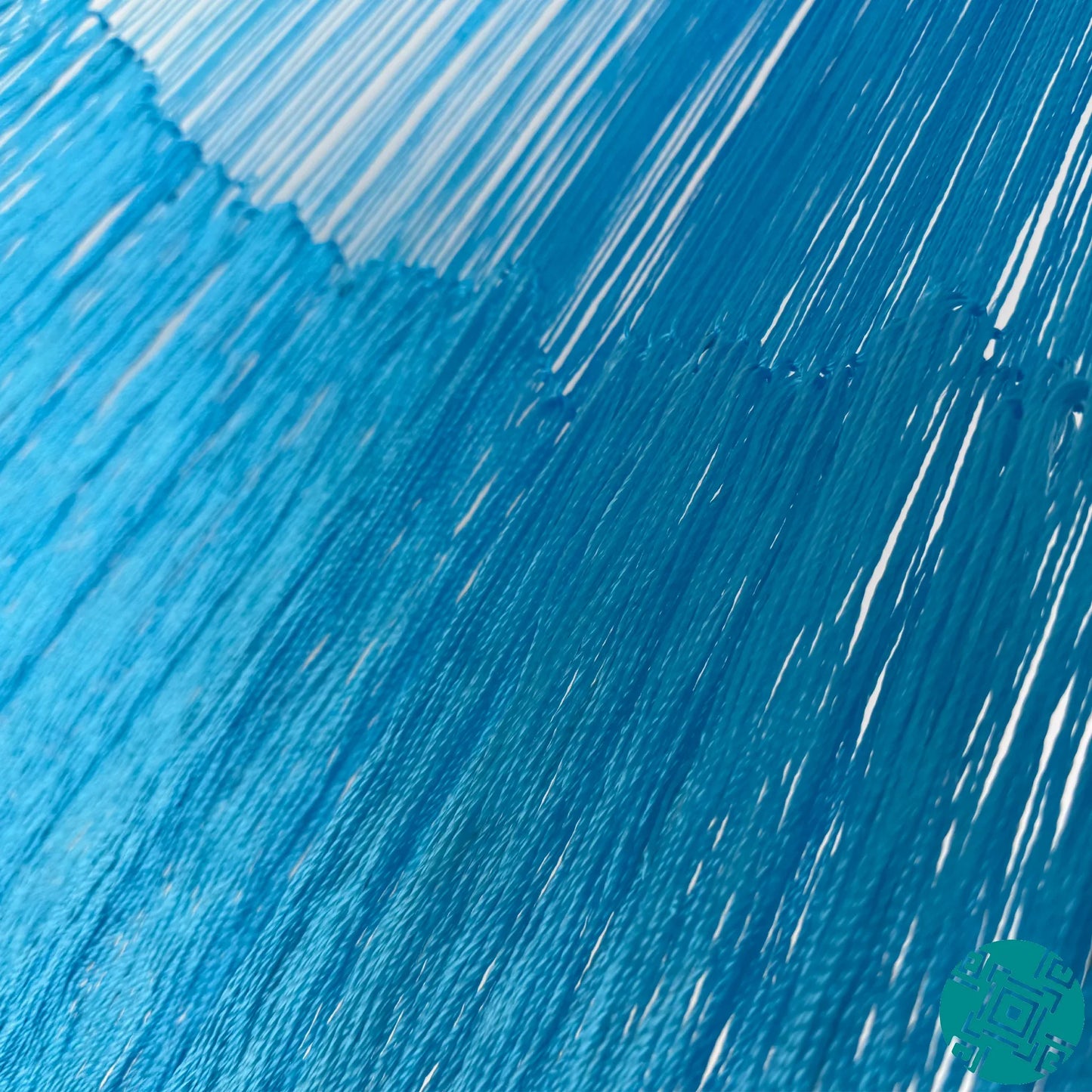 Unión entre el cuerpo y el brazo de hamaca artesanal Yucateca de nylon azul claro